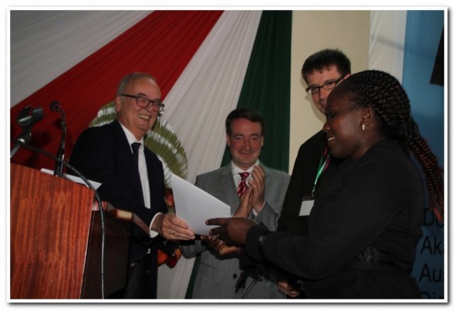 daad handing over a certificate to the scholar for masters